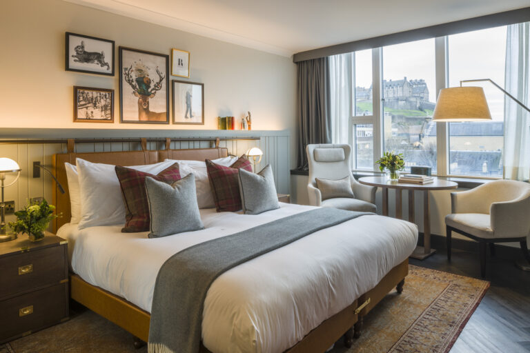 a bedroom with a bed and a table