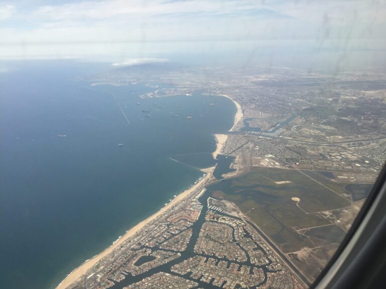 an aerial view of a beach and land