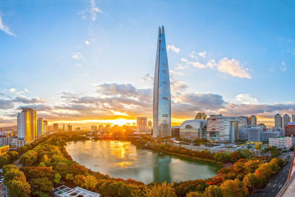 a city with a river and a tall building