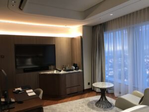 a room with a tv and a table