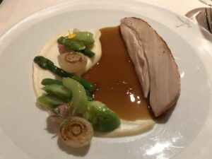 a plate of food with brown sauce