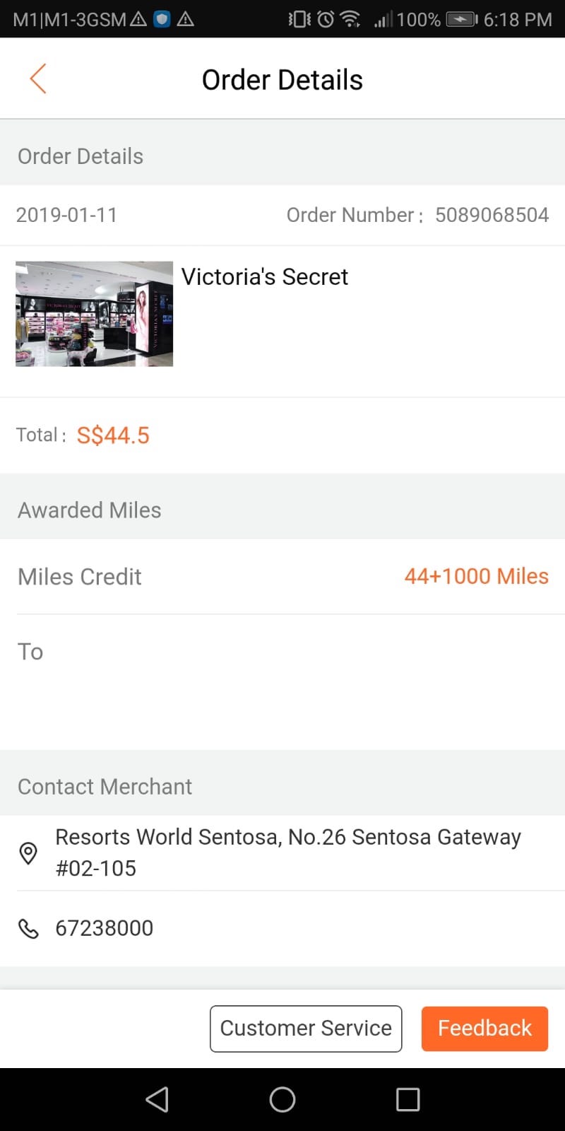 The image is a screenshot of an order details page from a mobile application. The details include:
- Order date: 2019-01-11
- Order number: 5089068504
- Store: Victoria's Secret (with a small image of the store)
- Total amount: S$44.5
- Awarded miles: 44+1000 Miles
- Contact merchant information:
- Address: Resorts World Sentosa, No.26 Sentosa Gateway #02-105
- Phone number: 67238000
- Buttons for "Customer Service" and "Feedback" at the bottom.