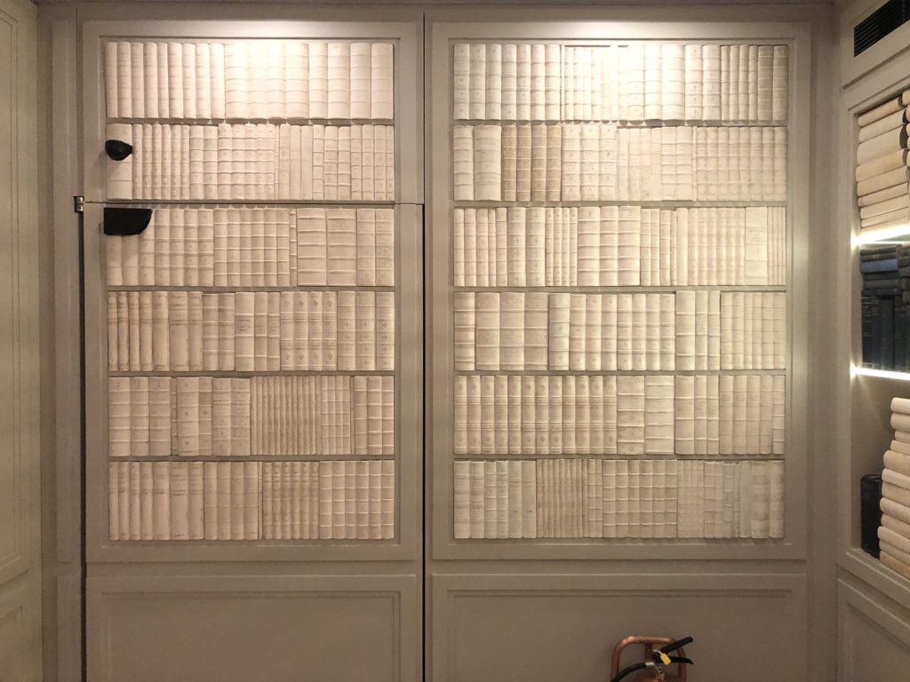 a door with a book shelf