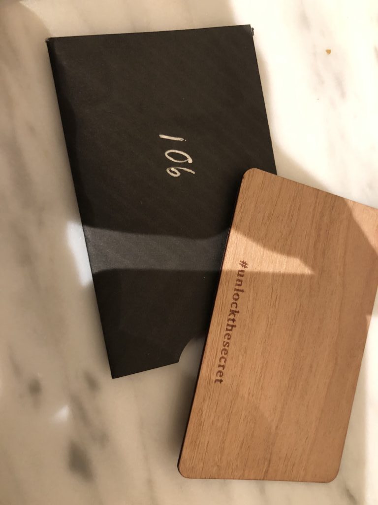 a black and wooden box with white text on it