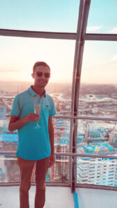 a man standing in front of a window