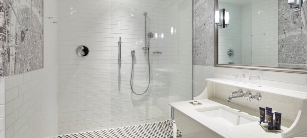 a bathroom with a shower and sink