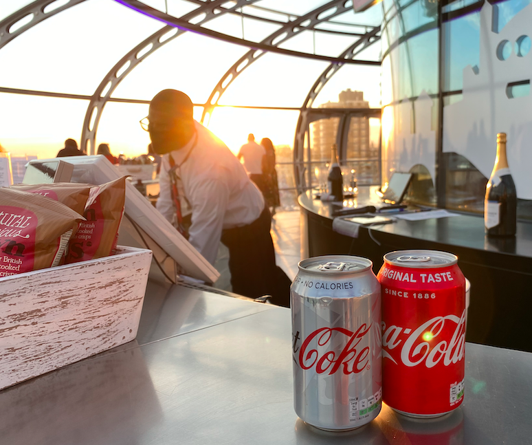 a two cans of soda on a table