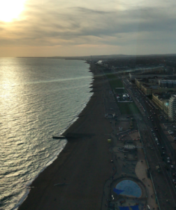 a beach with buildings and water