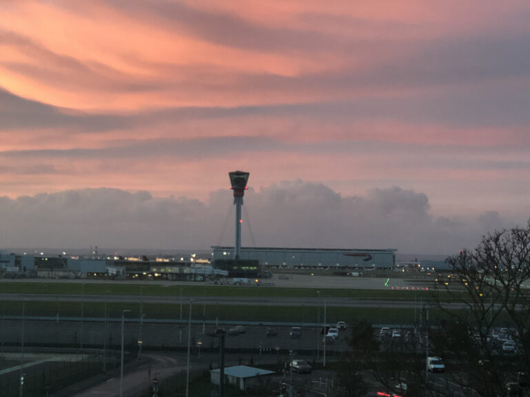 a building with a tower in the background